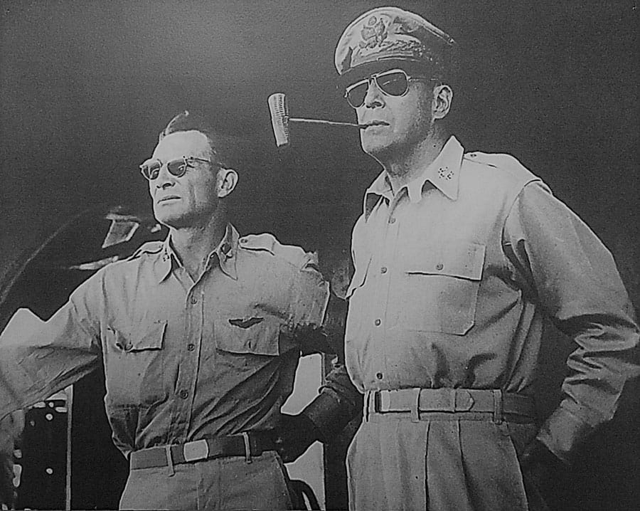 General MacArthur standing with soldier