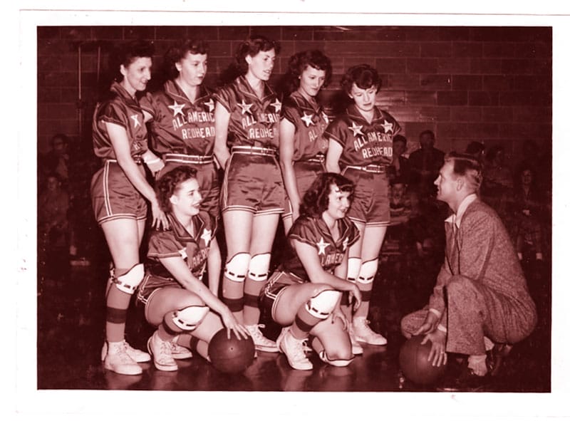 The All American Red Heads with coach Orwell Moore, whose daughter wrote two books about the team. One of the team’s uniforms remains at the Barry County Museum in Cassville.