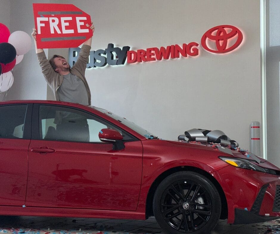 Photo 2 Man Outside Sunroof With Free Sign