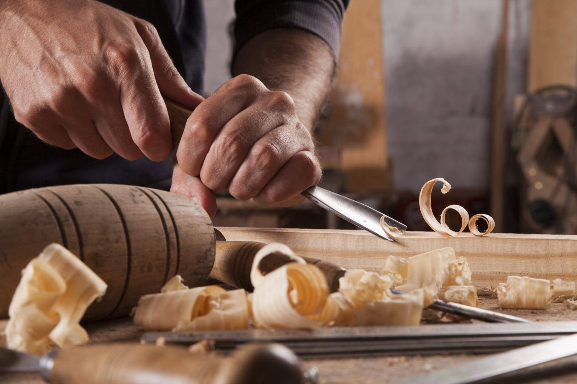 Hands Of Craftsman Carve With A Gouge